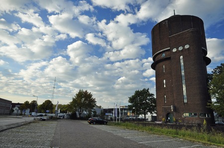 Breda, Netherlands - October 16, 2016: The Amsterdam School style water tower building on the Speelhuislaan, under the cloudy skyのeditorial素材