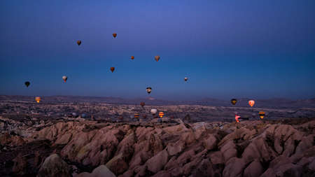 GOREME, CAPPADOCIA, TURKEY - November 12, 2021: The great tourist attraction of Cappadocia - balloon flight.のeditorial素材