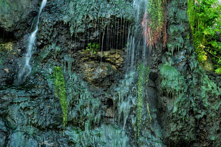 Closeup of a waterfall and mossy rocks. The amazing beauty of nature. Shaki waterfall. Armenia
