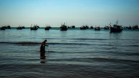People working in Mui Ne Fishing Village, Vietnam, December 11, 2019.