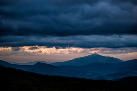 Dramatic cloudy sky over the mountains. Ostra Hora, The Carpathians, Ukraine.の写真素材