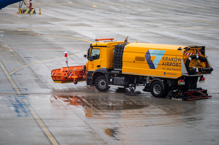 Krakow, Poland - November 18, 2022: Car preparing the runway at the John Paul II Krakow-Balice International Airport.のeditorial素材