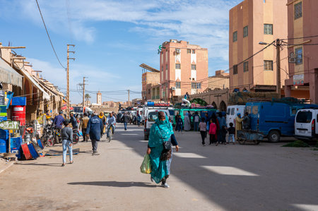 Rissani, Errachidia Province, Morocco - November 24, 2022: Sellers and buyers in a typical Arabian...