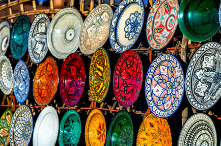 Tazentout, Ouarzazate, Morocco - November 28, 2022 - A set of traditional, handmade Moroccan clay dishes in the local shop. Bowls, plates, tagines, jugs.のeditorial素材