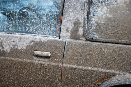 Mad splattered 4x4 SUV. Dirty car side. Splash and texture of mud on a car.の写真素材