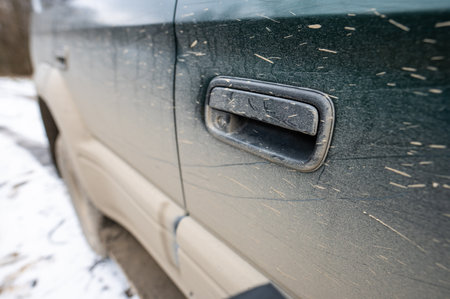 Dirty car side. Splash and texture of mud on a car.の写真素材