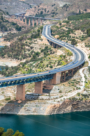 A view of the Rules Reservoir and the road A-44. Velez de Benaudalla, province of Granada, Andalusia, Spain.の写真素材
