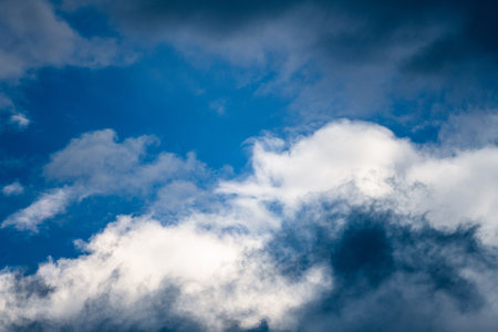 Clouds in the blue sky. Natural background with a space for title or description.の写真素材