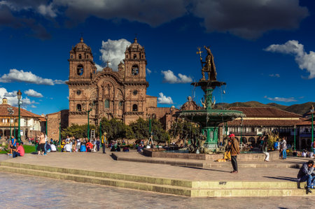 Fountain of the Inca Pachacutec with the cathedral in background on the Plaza de Armas of Cusco, Peru.のeditorial素材