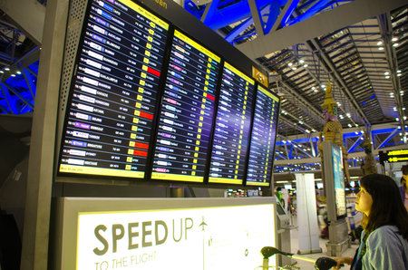 BANGKOK - JAN 18, 2016 : A travellers who see terminal schedule board at Suvarnabhumi International...