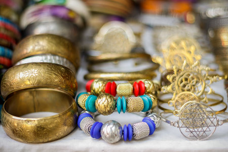 vibrant woman accessory lying on a table for sale outside of a shopの写真素材