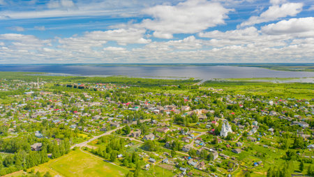 a mesmerizing birds eye view of the Russian village of Kubenskoe located near the lakeの写真素材