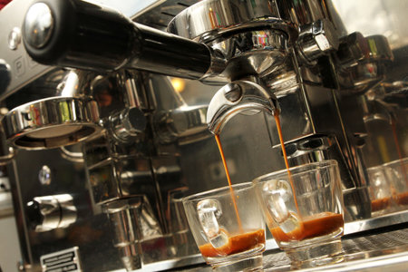 Espresso being prepared from coffee machineの写真素材