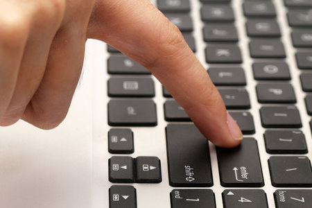 Finger pressing on ENTER button