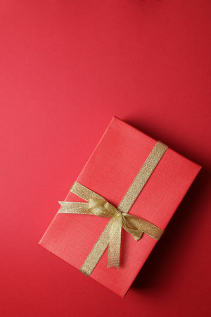 Present on red backgroundの写真素材