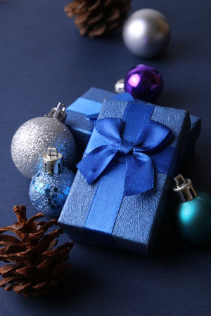 Blue present boxes with christmas decoration on blue backgroundの写真素材