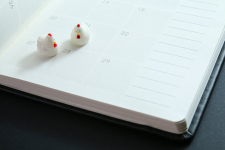 Chinese new year decorations on planner with focus on chinese new year date for year 2017.の写真素材