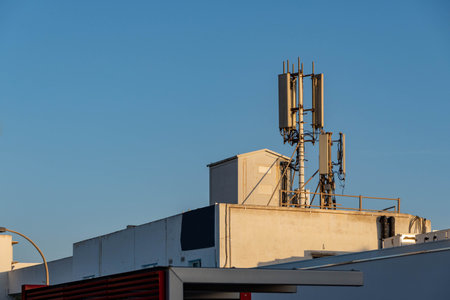 roof top of a house with mobile communication antennaの写真素材