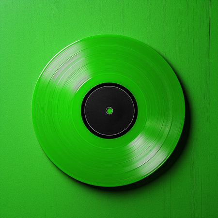 Vinyl record on green background. Top view. Copyspace.の素材