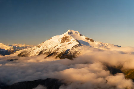 Mountains in the clouds at sunset. Caucasus Mountains, Georgia, region Gudauri.の写真素材