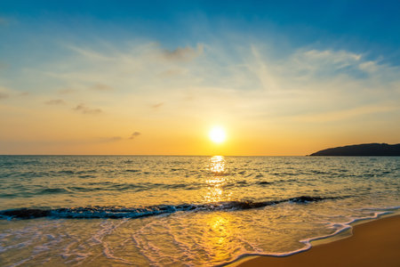 Beautiful tropical beach and sea with coconut palm tree at sunset time for travel and vacationの写真素材