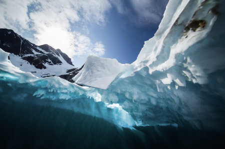 icecaps in the Antarctica with iceberg in the ocean swimming around and melting in the sea