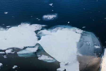 Icebergs floating in the water. Global warming, climate change and global warming concept