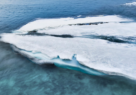 Icebergs floating in a lagoon on the surface of the water
