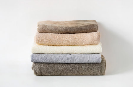 Stack of clean towels on a white background. Close-up.の写真素材