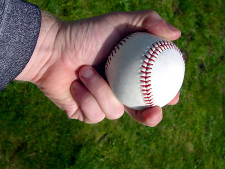 Hand holding a baseball