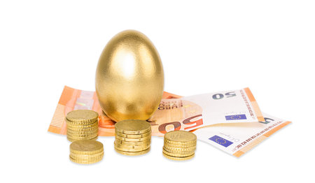 Coin and golden eggs, the concept of financial growthの写真素材