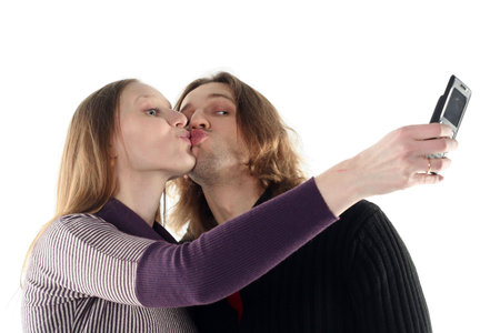 Portrait of young couple in studio isolated on white backgroundの写真素材