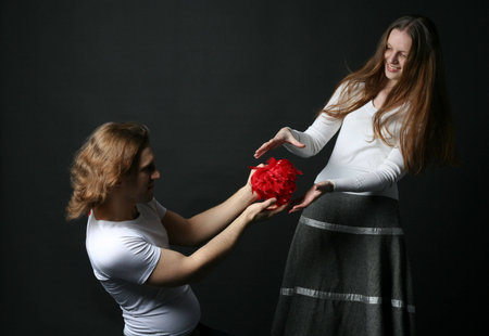 Young Man and woman isolated on black backgroundの写真素材