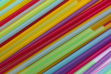 Plastic tubes of different colors in the background.