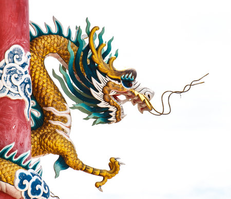 Golden Chinese Dragon Wrapped around red poleの写真素材