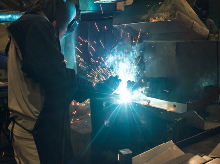 Industrial steel welder in factory