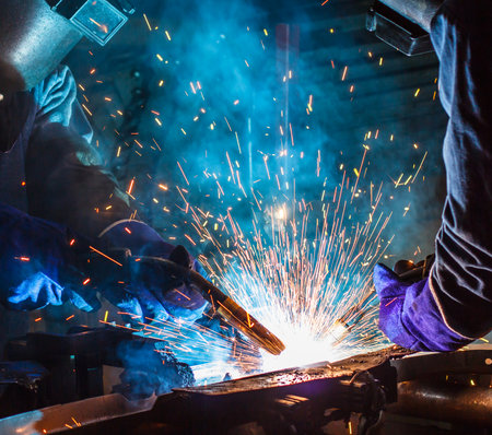Team work welder steel in Industrialの写真素材