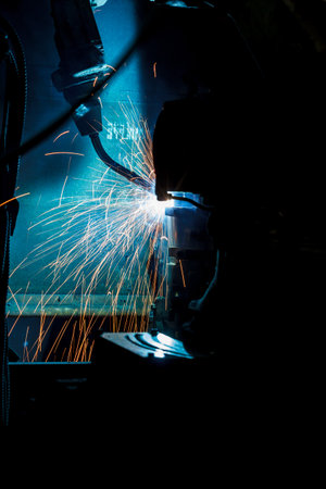 Welding robots movement in a car factory industryの写真素材