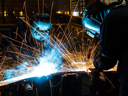worker with protective mask welding metalの写真素材
