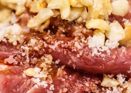 Fresh raw meat with spices close-up. Sliced Beefの写真素材