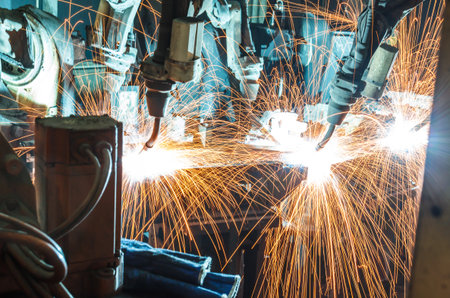 Team welding robots represent the movement in the automotive parts industry