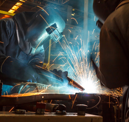 worker with protective mask welding metalの写真素材