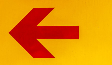 Arrow image red yellow background.の写真素材