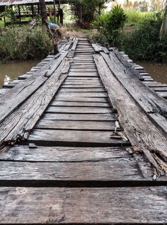 The old wooden bridge that used to cross the canal.の写真素材