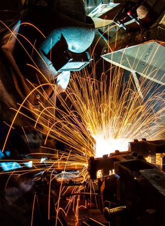 worker with protective mask welding metalの写真素材