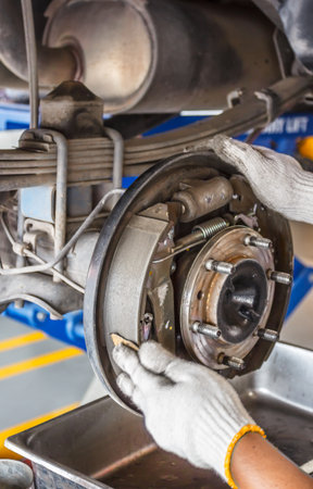 maintenance car brakes hub in garageの写真素材