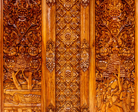 Wood windows carving and painted of Thai templeの写真素材