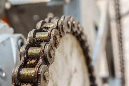 Old rusty gear wheel with chain on outdoor