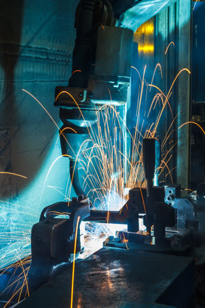 Welding robots movement in a car factoryの写真素材