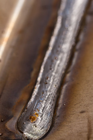 welding seam onto steel sheet metal Industrial steel welder in factory
